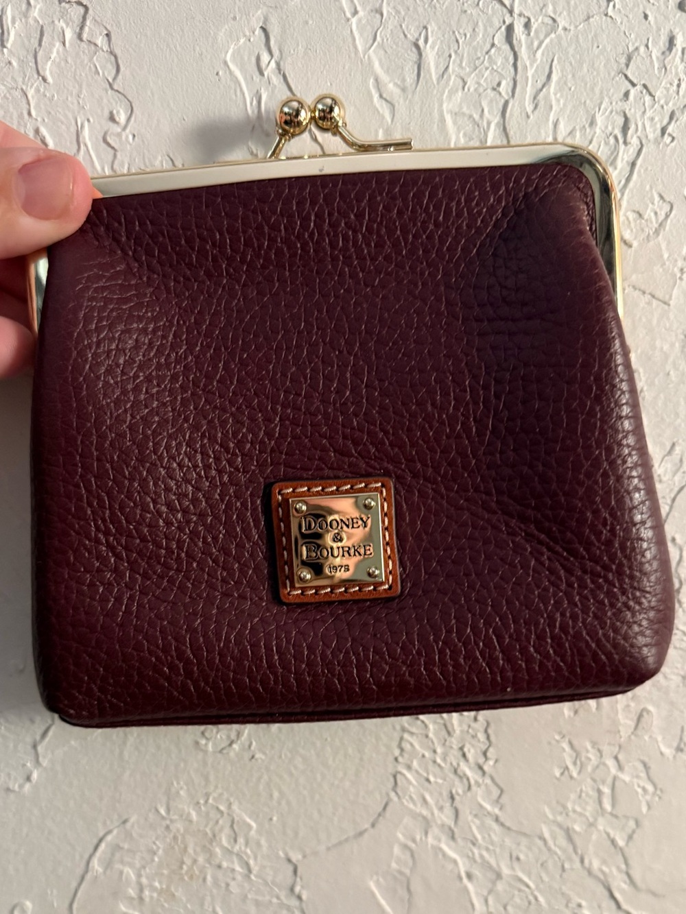 Dooney & Bourke Deep Burgundy Pebbled Leather Kiss-Lock Wallet with Gold Plaque